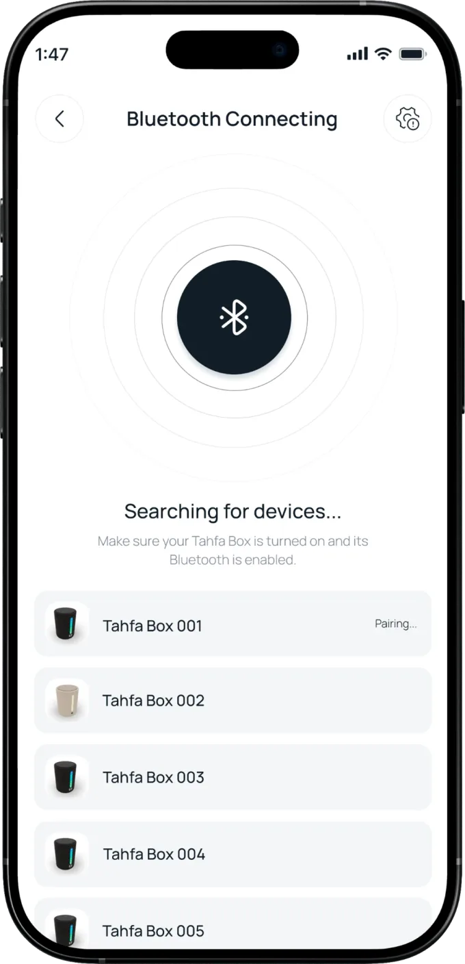 The Bluetooth screen searching for devices, with nearby Tahfa Boxes listed and one of them pairing.